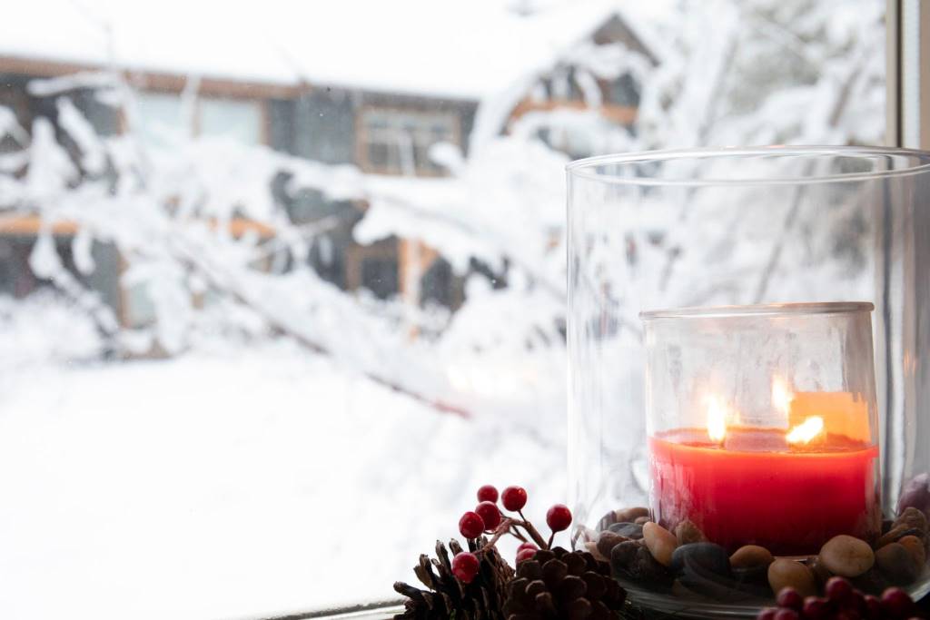 Chicago apartment window in winter showing sealed indoor space with candle light